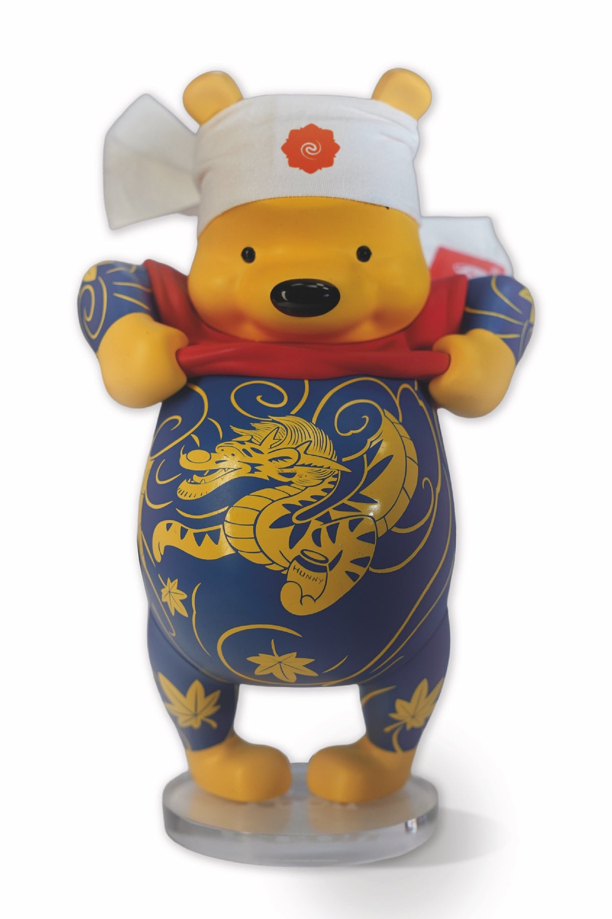 Tatpooh Shokunin vinyl figure by Jee Sayalero, front view on white with hachimaki and clear acrylic base, 23 cm